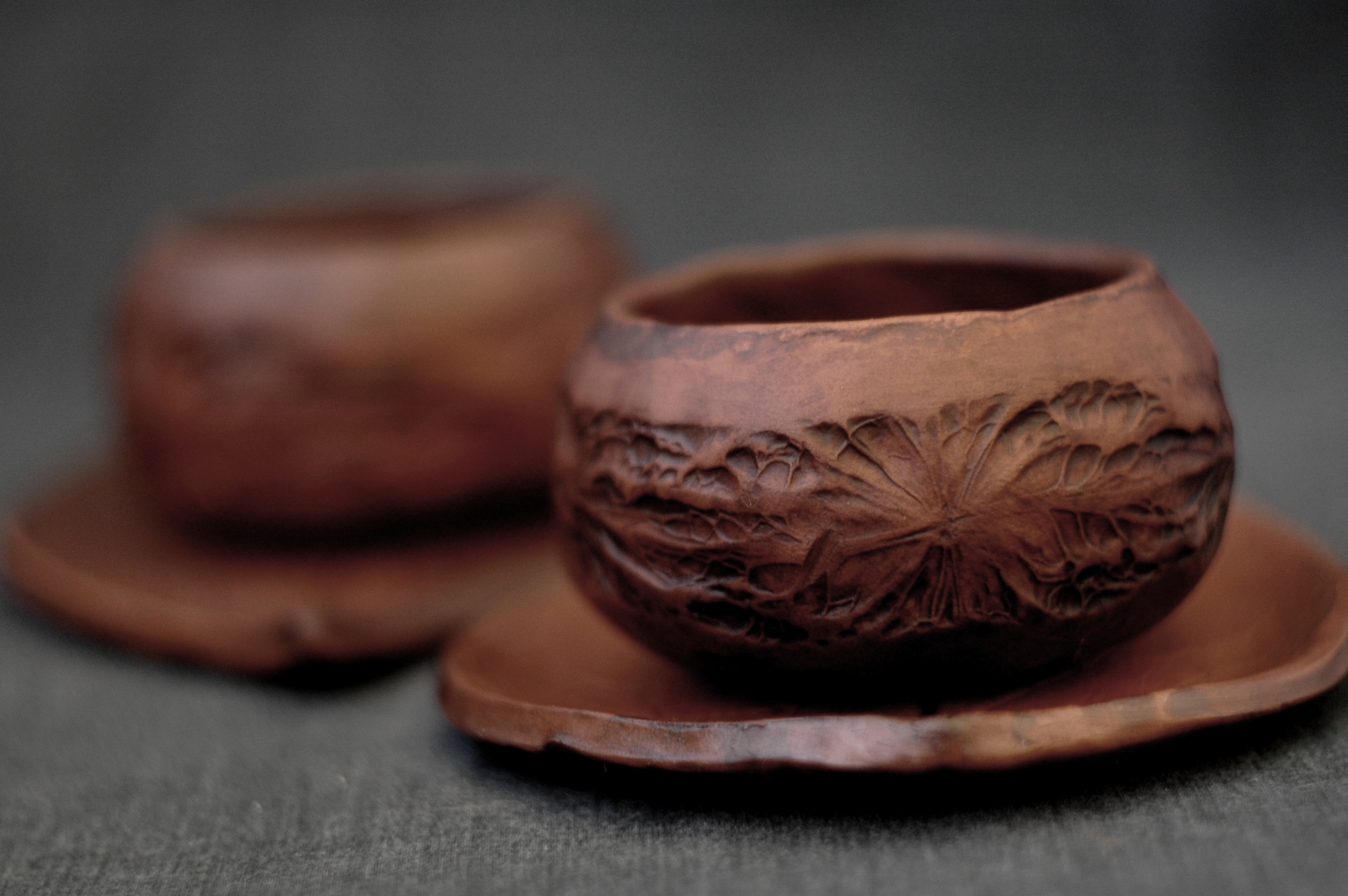 Walnut set of two pottery clay mug and saucers