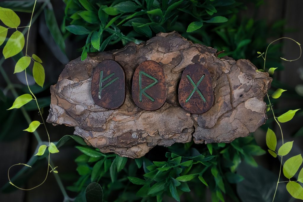Oval set of runes made of pottery clay Elder Futhark